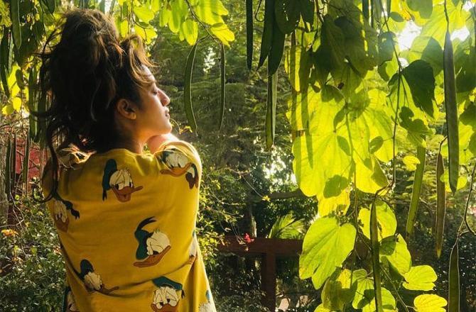 In picture: Nusrat Jahan looks uber cool as she stuns in a donald duck printed yellow t-shirt.