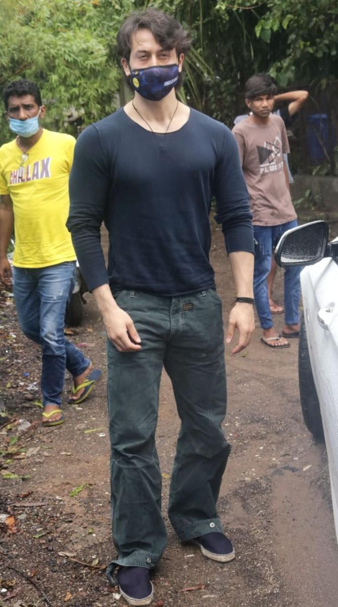 Tiger Shroff was also clicked in the same suburb. The actor opted for a black t-shirt and grey pants for the outing.