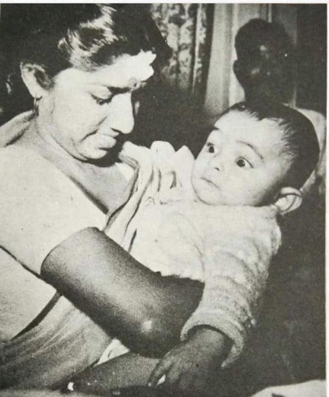 Lata Mangeshkar and Rishi Kapoor collaborated for the latter's debut in Hindi Cinema Bobby in 1973. They went on to do Yash Chopra's Chandni in 1989, another classic known for its music. 
In picture: Late actor Rishi Kapoor had shared this vintage photo of himself as a baby being cradled by none other than the incredible Lata Mangeshkar. The legendary singer can be seen holding a baby Rishi Kapoor in her arms as he looks on wide-eyed. Check out the cute photo and the cuter caption below: 