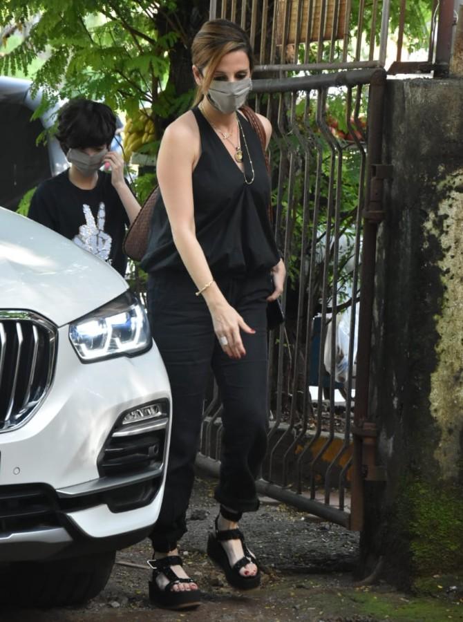 Sussanne Khan was snapped by the paparazzi with her younger son Hridhaan Roshan in Juhu, Mumbai. The mother-son duo twinned in their black outfits shedding out some serious family goals. (All pictures: Yogen Shah).