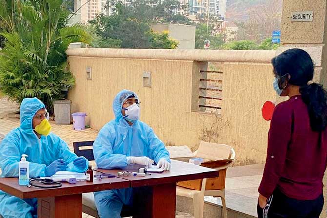 A student being screened for COVID-19 symptoms. file pic