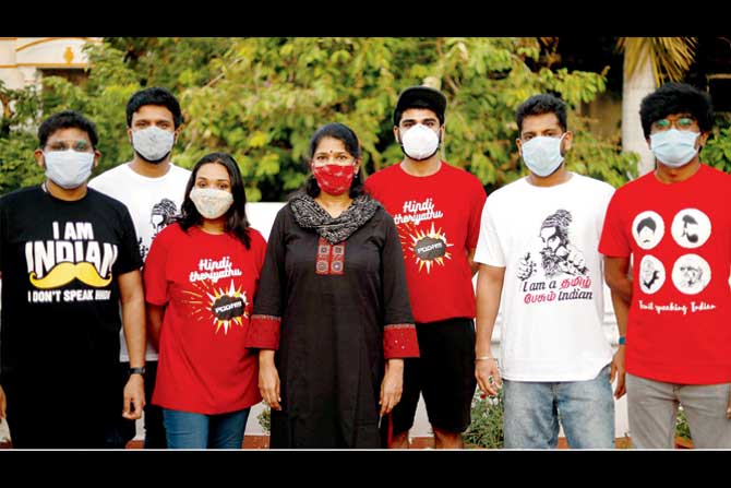 MP Kanimozhi with youth wearing anti-Hindi T-shirts. PIC/Twitter