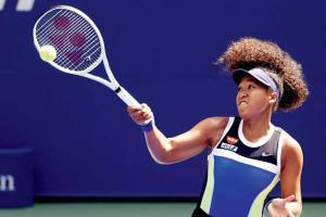 Japan's Naomi Osaka survives scare to enter Last 16