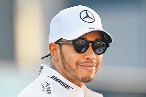 Lewis Hamilton takes pole with lap record; Ferrari toil