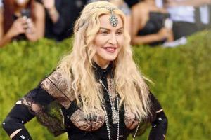 Madonna to helm her biopic, co-written by Oscar-winning writer Diablo C
