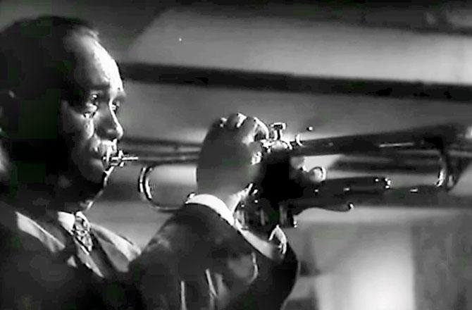 Chic Chocolate trumpeting "Rut jawaan jawaan" in Akhri Khat. After he died, the musician