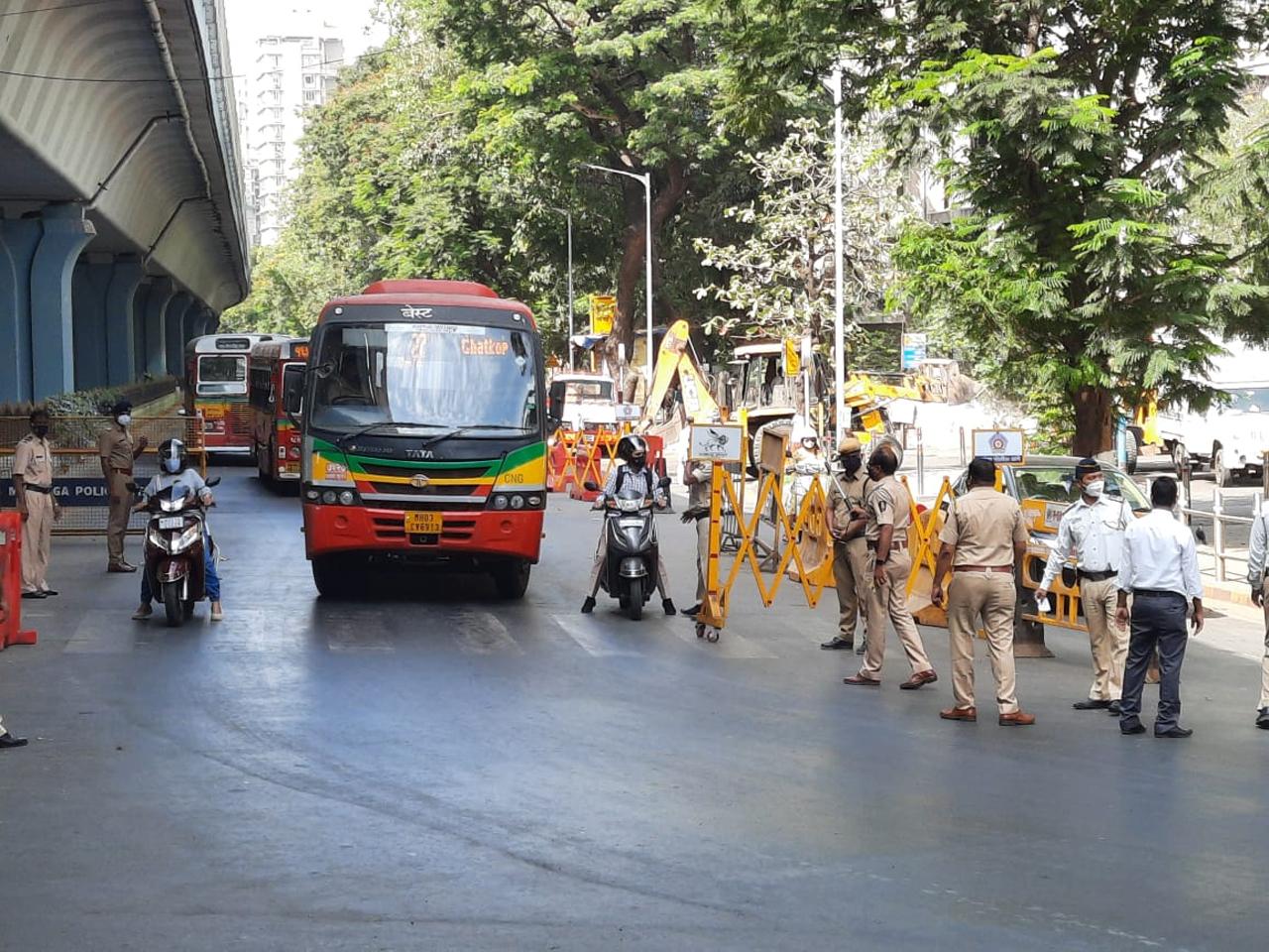 On Day 1 of the lockdown announced by Maharashtra in wake of the rise in covid cases, most Mumbaikars stayed home as Section 144 was imposed across the state.
In photo: Mumbai police personnel take action against vehicles on the street without colour-coded stickers during blockade at Matunga. Photo: Pradeep Dhivar