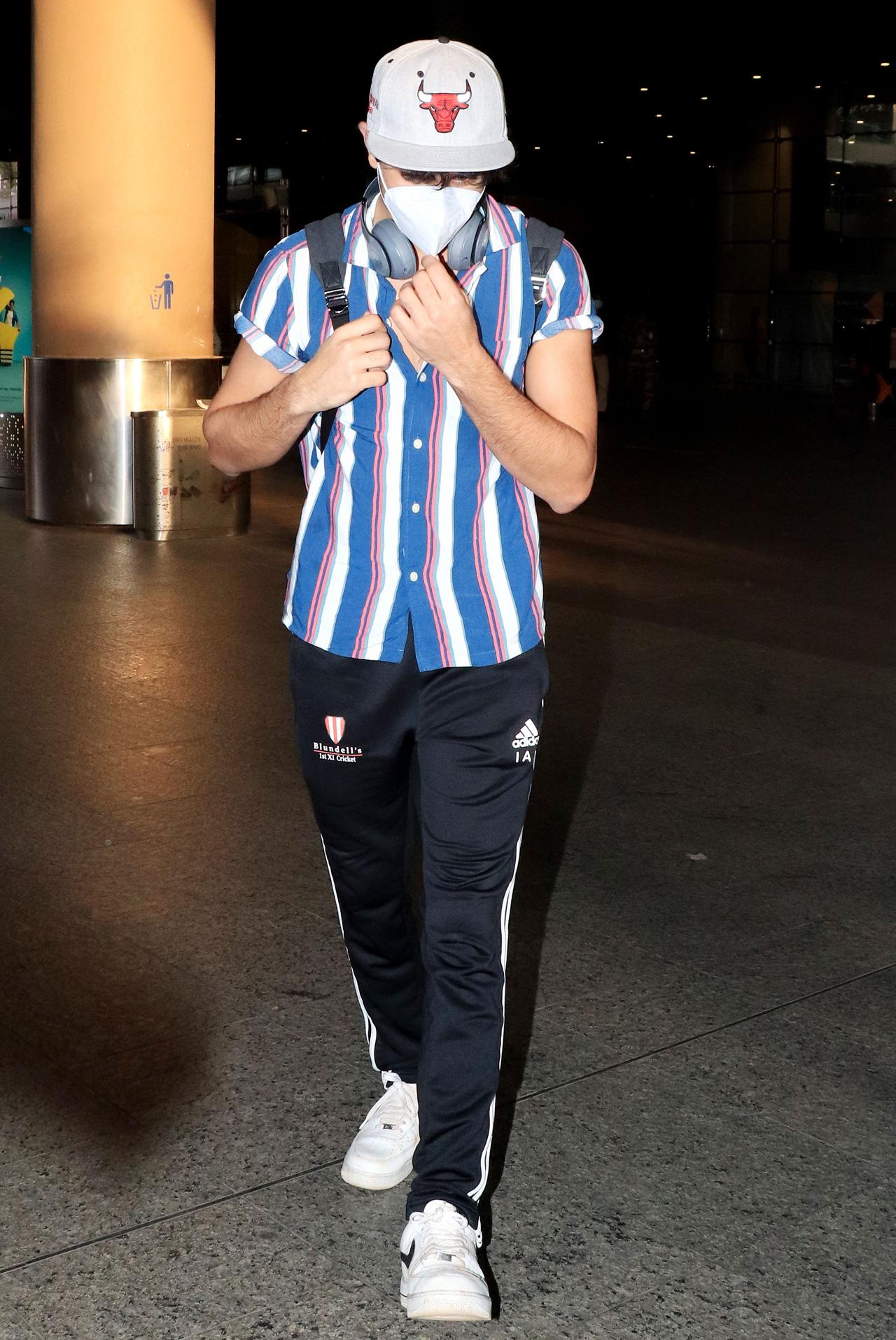 Ibrahim Ali Khan striped shirt and track pants as he arrived at Mumbai airport.