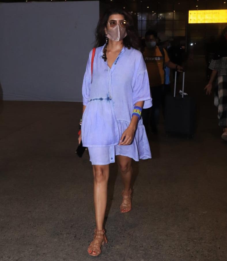 South actress Lakshmi Manchu was also snapped at Mumbai airport. The actress kept it comfy yet stylish as her airport look. She opted for a loose blue dress, with minimal accessories.