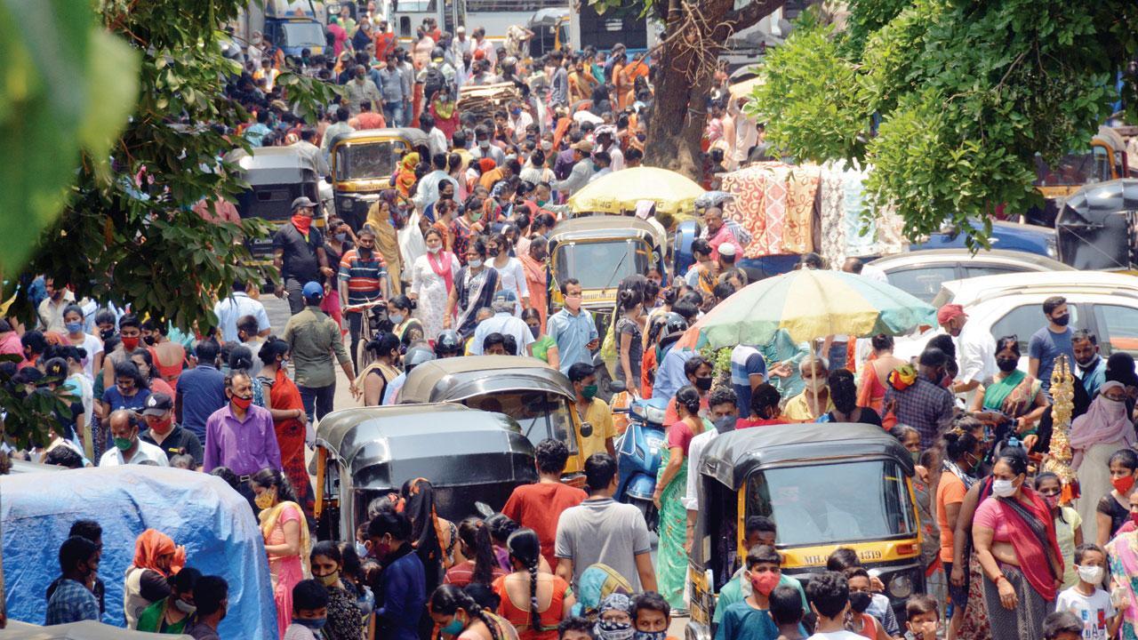Mumbai: North of city, crowded bus stop, station and markets