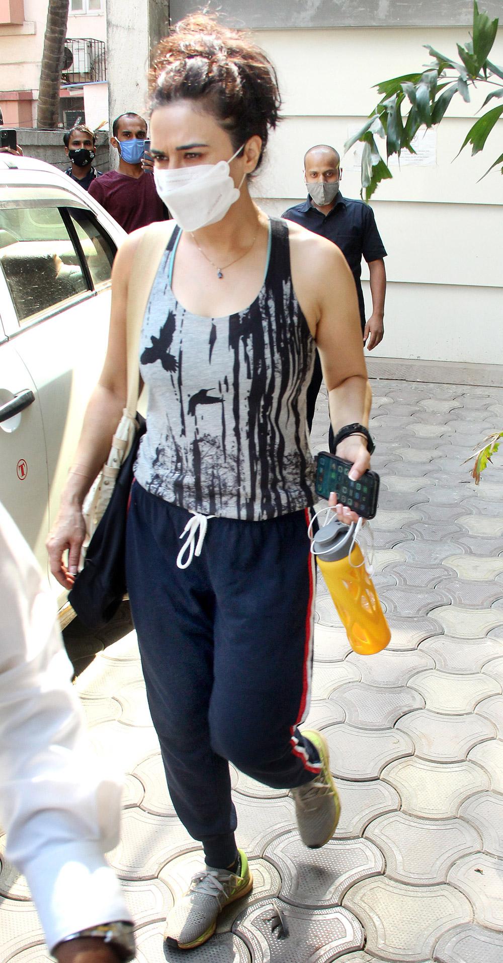 Preity Zinta dressed in a grey tank top, navy blue track pants and white face mask as she was clicked out and about in Bandra, Mumbai.