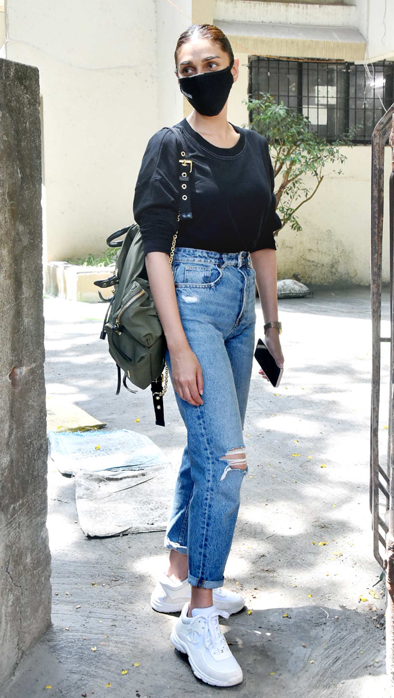 Aditi Rao Hydari was snapped at a salon in Juhu, Mumbai. The actress was seen wearing a black top, paired with distressed denim and white sneakers during the outing. On the professional front, Aditi was last seen in The Girl On The Train, also starring Parineeti Chopra and Kirti Kulhari. All pictures/Yogen Shah