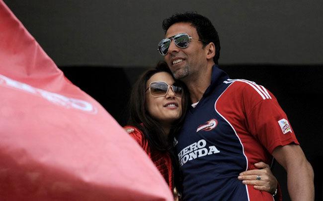 King roots for Kings: Co-owner of Kings XI Punjab, Preity Zinta (L) hugs fellow Bollywood film actor Akshay Kumar during the IPL match between Delhi Daredevils and Kings XI Punjab at The Newlands Cricket Stadium in Cape Town on April 19, 2009