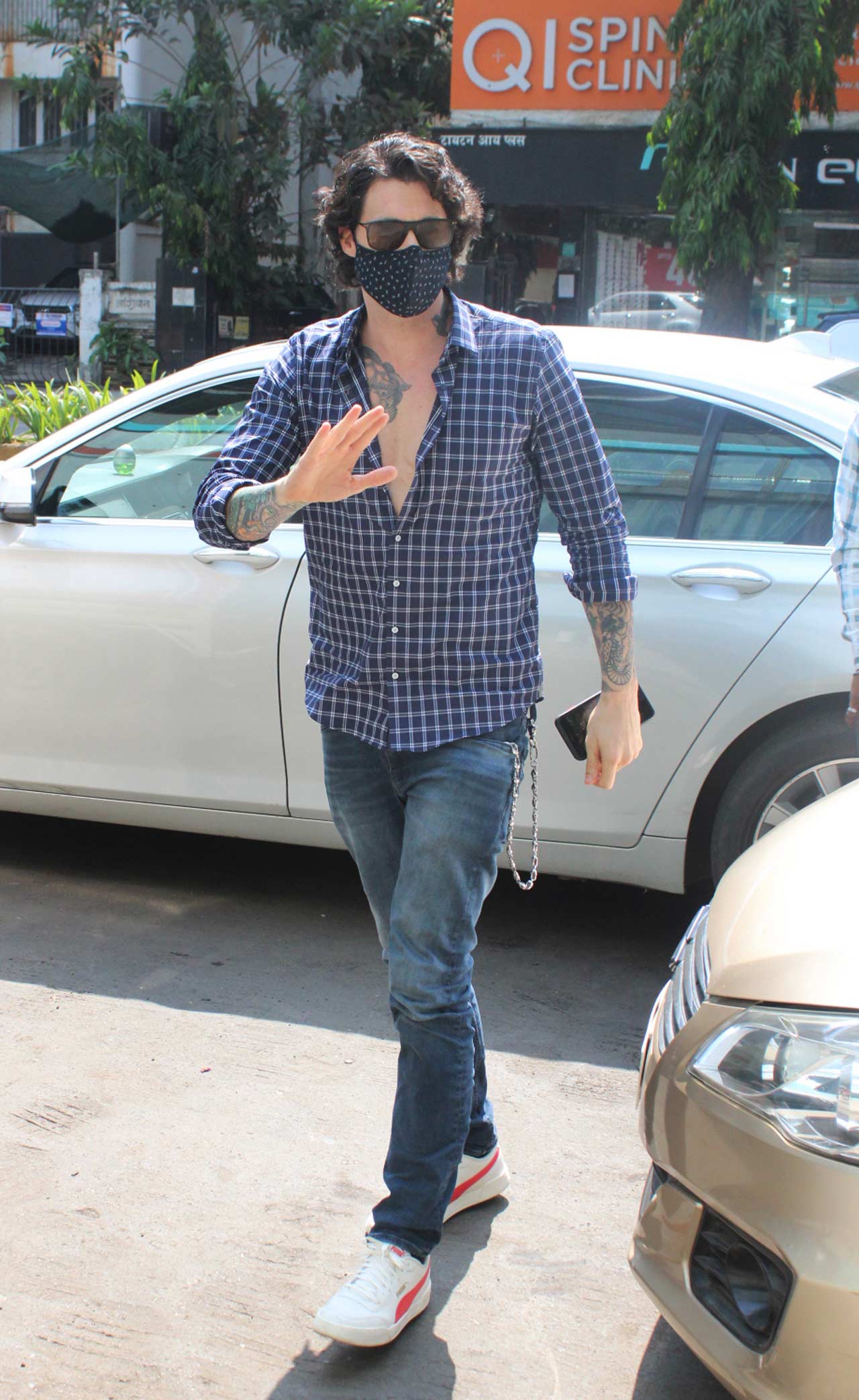 Daniel Weber, Sunny Leone's husband, waved at the shutterbugs when snapped in Mumbai. Daniel was seen wearing a casual shirt, paired with basic denim and white sneakers.