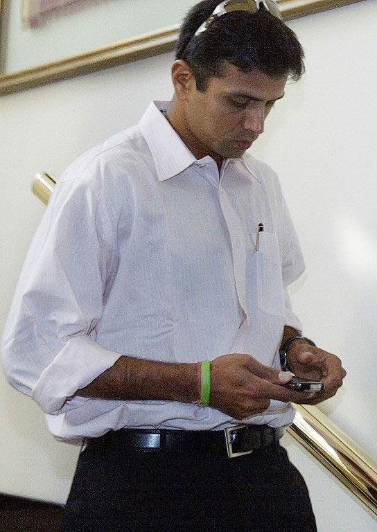 Dialled in: Rahul Dravid arrives for the inaugural Indian Premier League (IPL) Twenty20 players' auction in Mumbai on February 20, 2008. He was RCB's captain in 2008