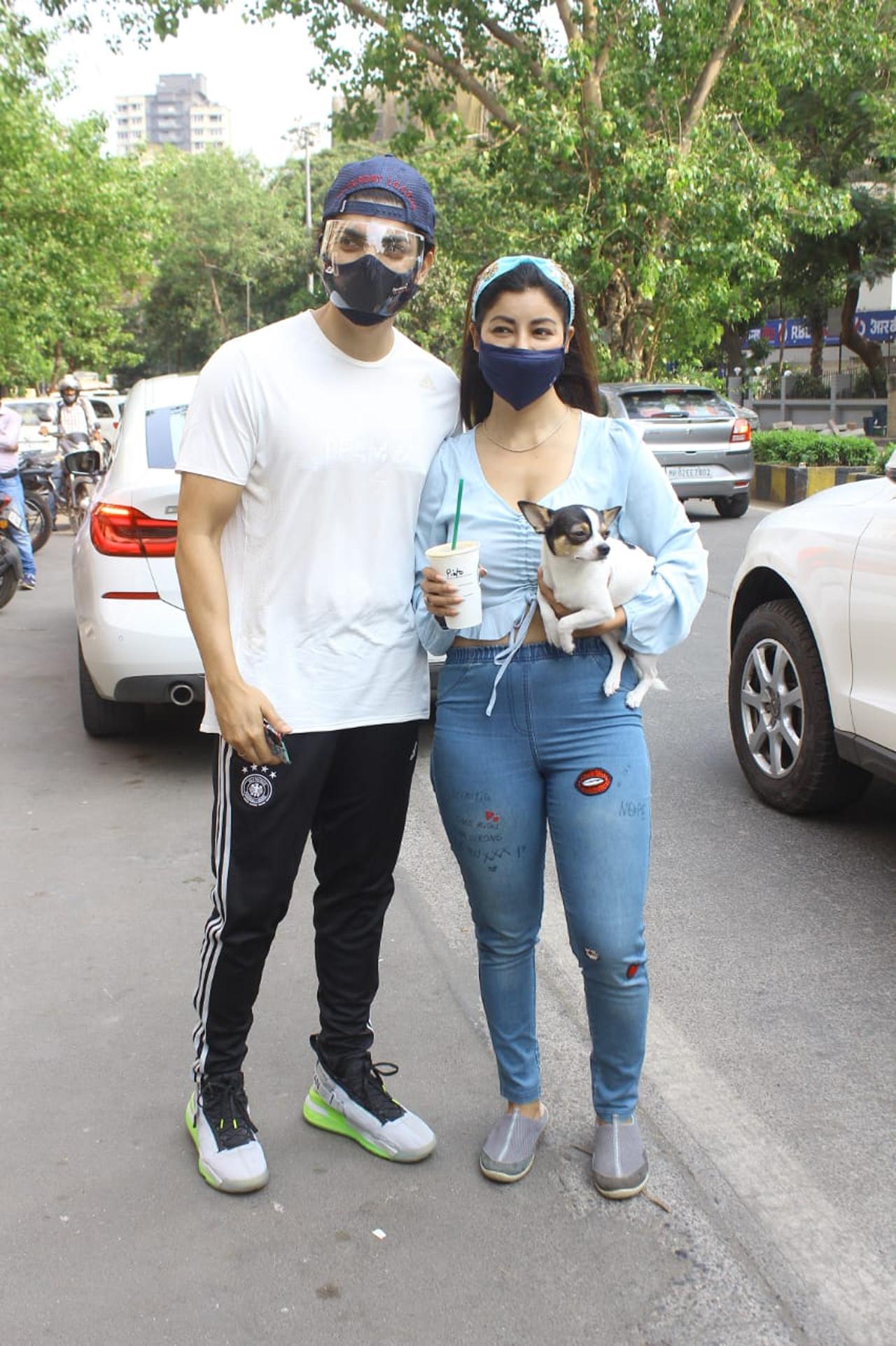 Gurmeet Choudhary and Debina Bonnerjee stepped out with their pooch and visited a cafe in Andheri. The couple was clicked while exiting the cafe.