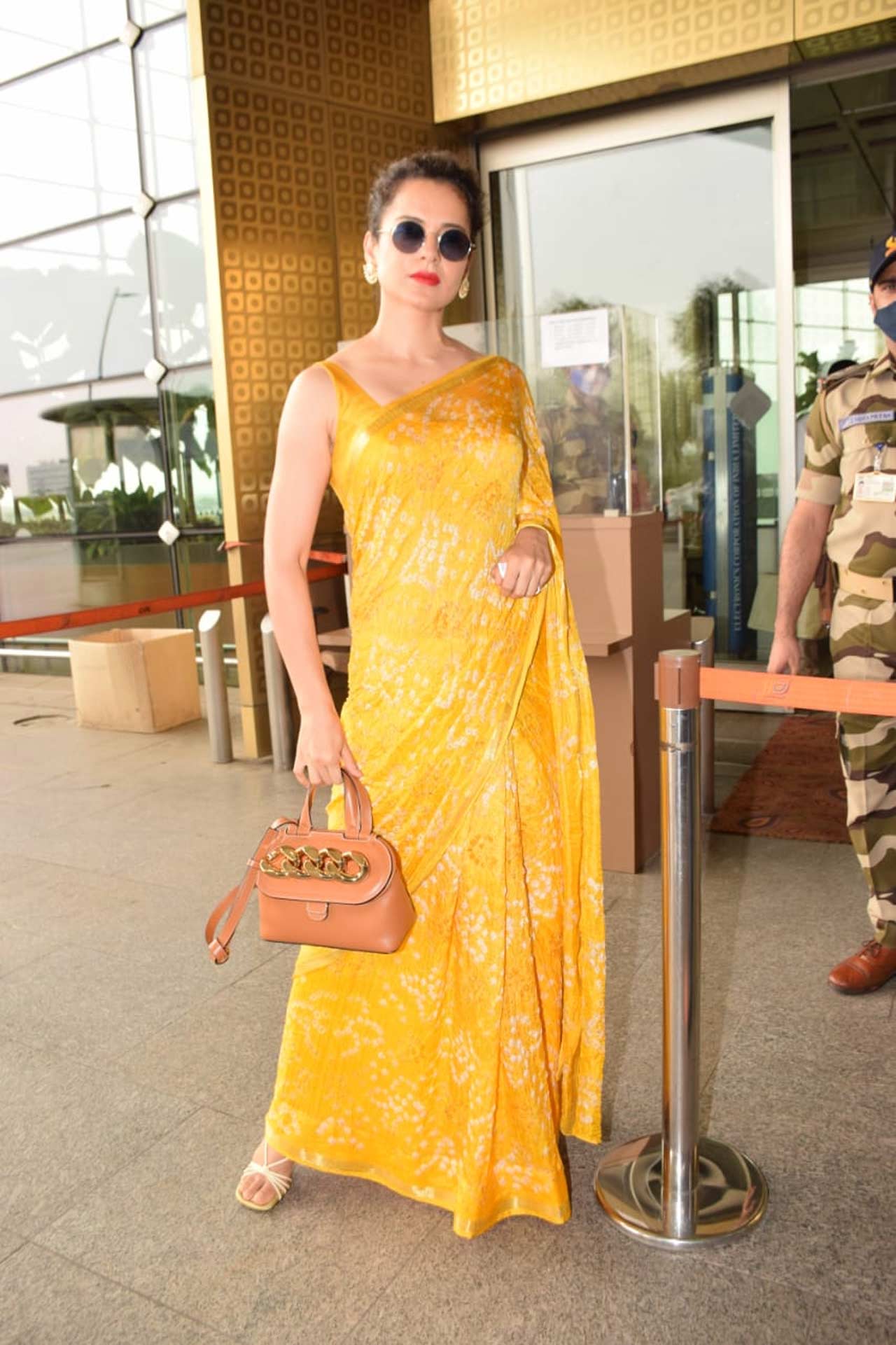 Kangana Ranaut looked no less than a ray of sunshine in a yellow saree which she opted for as her airport look. Her dramatic studs and red lipstick added an oomph factor to her chic avatar. On the work front, Kangana will be next seen in Thalaivi, Dhakad, Tejas. All pictures/Yogen Shah