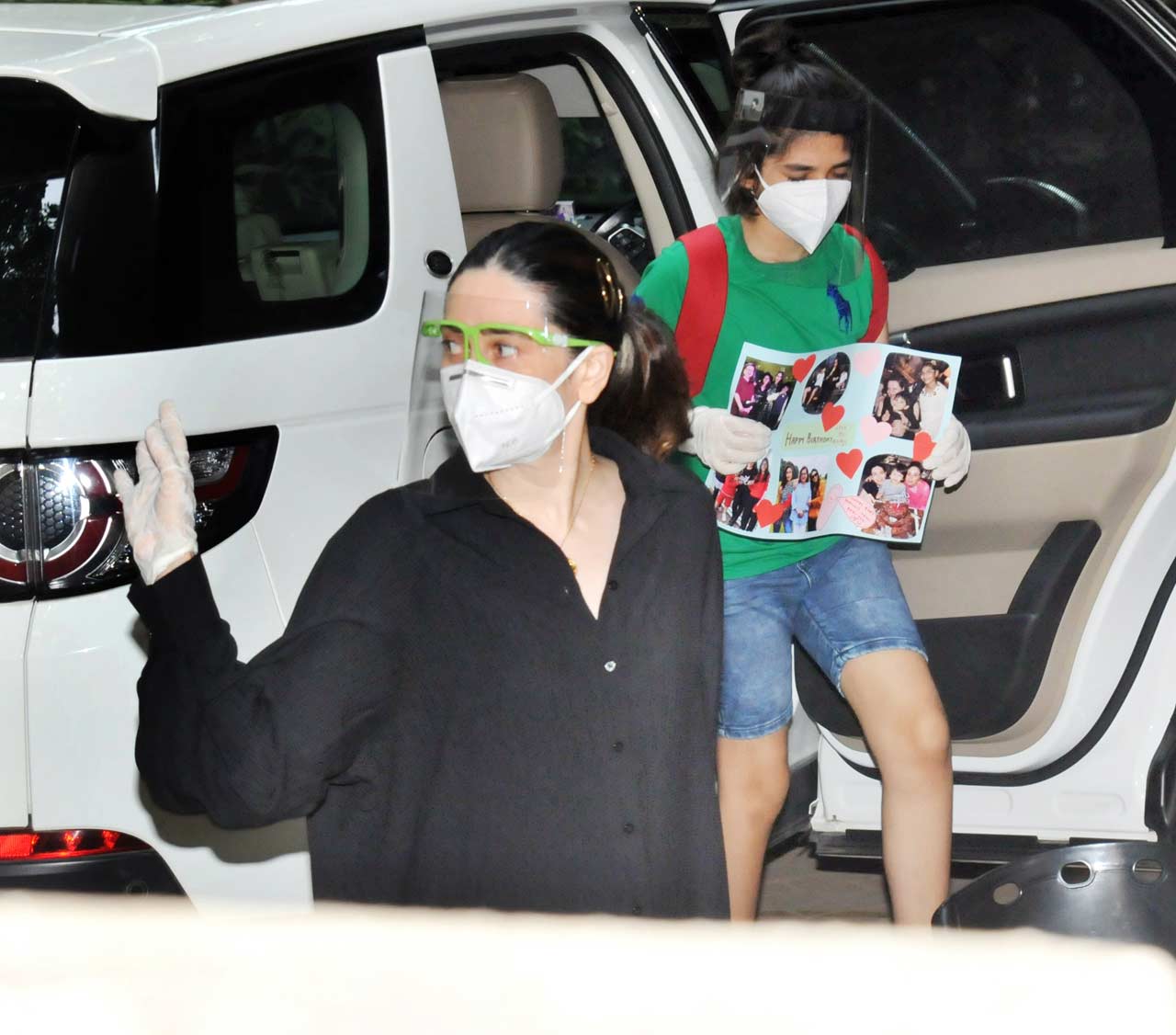 Karisma Kapoor was snapped with kids - Kiaan and Samaira at Kareena Kapoor Khan's residence in Bandra, Mumbai. The yesteryear actress stunned in an oversized black shirt dress during the outing. All pictures/Yogen Shah