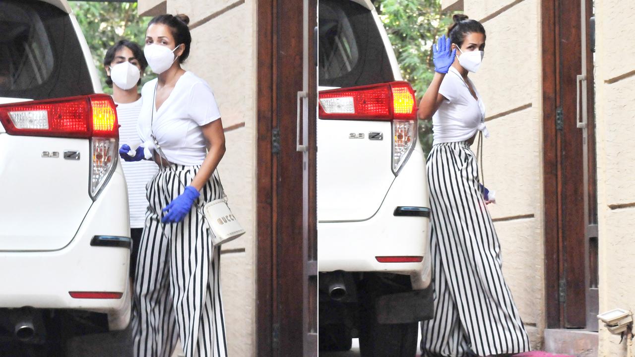 Malaika Arora was snapped with her son, Arhaan Khan in Bandra. The actress was dressed in black and white striped palazzo pants, paired with a white t-shirt, while her son opted for a striped t-shirt and shorts.