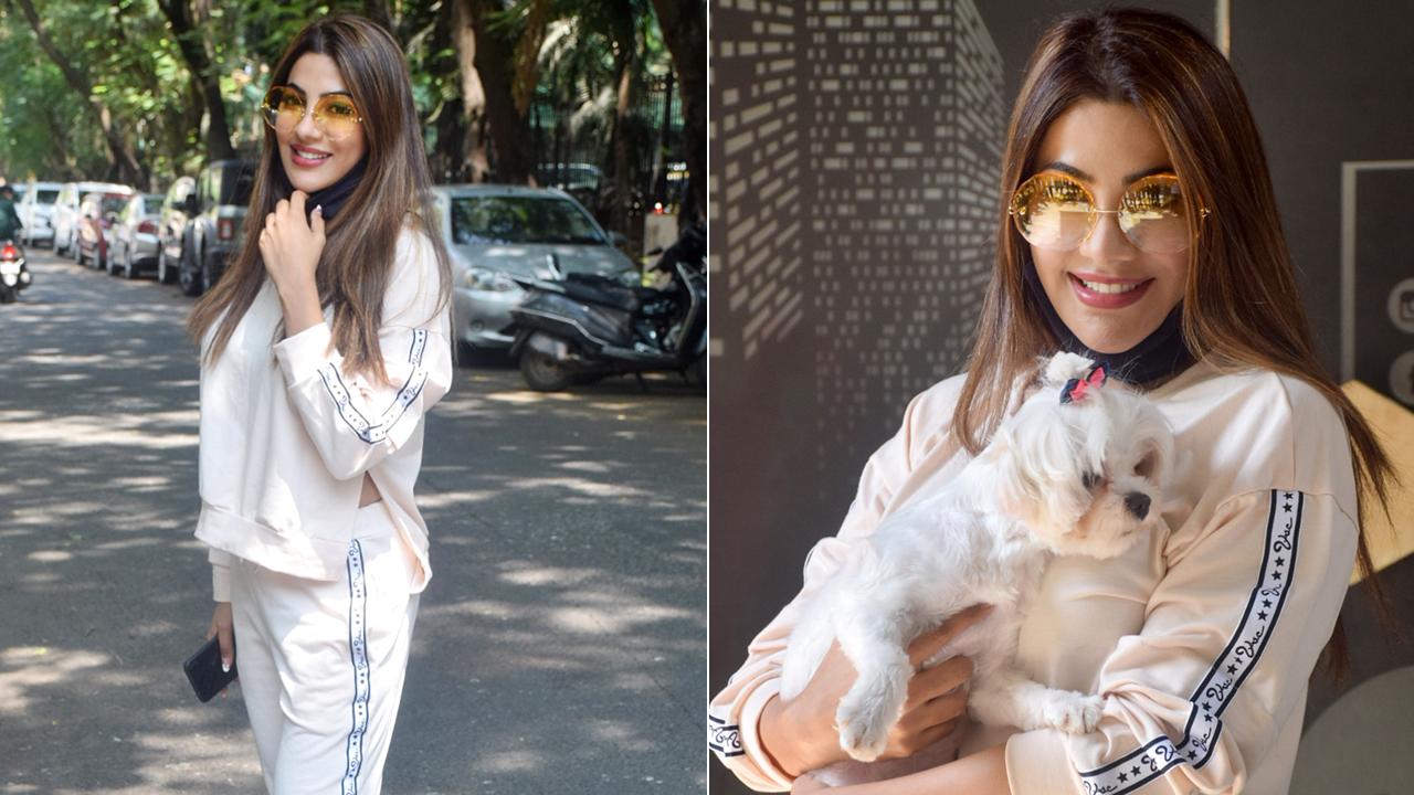 Bigg Boss 14 fame Nikki Tamboli was clicked with her pet, as she visited a veterinary clinic in Andheri, Mumbai. Nikki was photographed in a white tracksuit, looking her stylish best.