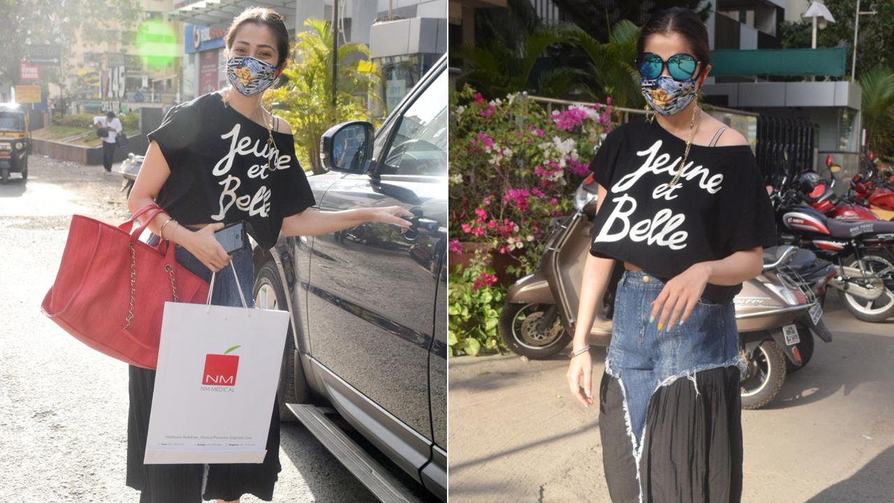 Actress Raai Laxmi was spotted in Andheri, Mumbai. The actress opted for a black crop top, paired with fancy black pants with a denim patch.