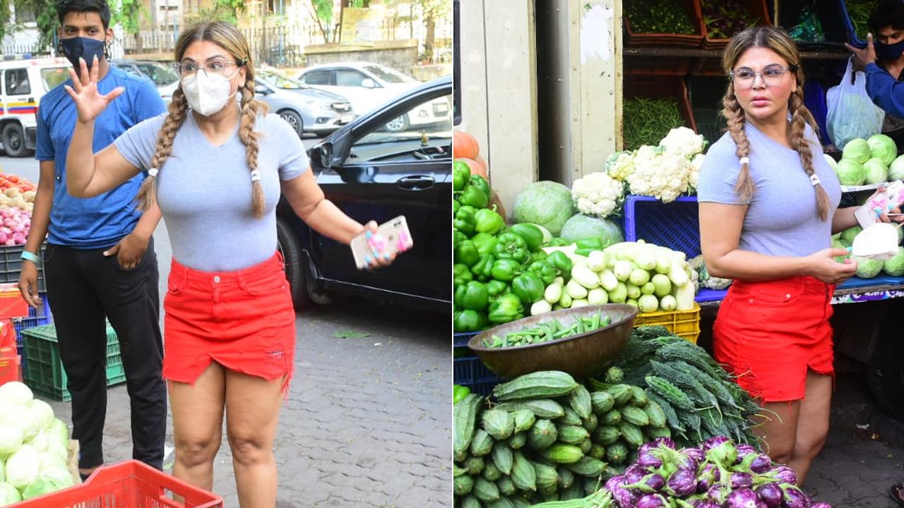 Rakhi Sawant was clicked by paparazzi, while she was shopping for vegetables in Lokhandwala market. She opted for a grey t-shirt and red denim skirt and tied her hair in two braids and wore glasses. Rakhi even had her mini-drama moment with the vendor. She got angry when the vendor asked her to pay Rs 1650 for the vegetables. (All photos/Yogen Shah)