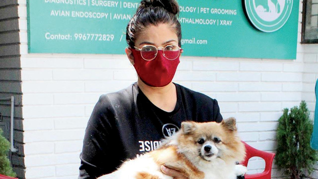 Handle with care! Raveena Tandon appears to be anxious about her pet's well-being