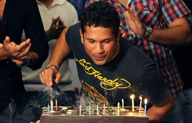 Cake that!: Sachin Tendulkar blows out candles on a cake at a surprise birthday party in Durban early April 24, 2009. Tendulkar celebrated his 36th birthday with friends and teammates in South Africa during the Indian Premier League in 2009