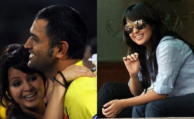 Mr and Mrs Cool:  (Left) Chennai Super Kings captain Mahendra Singh Dhoni hugs his wife Sakshi after winning the IPL Twenty20 cricket final match between Chennai Super Kings and Royal Challengers Bangalore at The M.A.Chidambaram Stadium in Chennai on May 28, 2011. (Right) Sakshi watches the IPL match between Chennai Superkings and Kings XI Punjab at the Punjab Cricket Association (PCA) stadium in Mohali on April 13, 2011