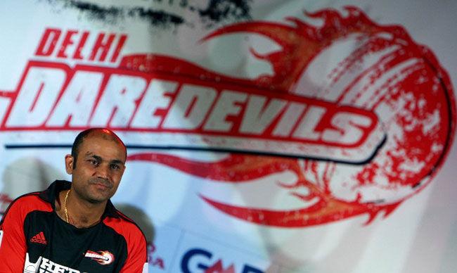 Hair we go! Former captain of Delhi Daredevils team Virender Sehwag looks on during a press meet in New Delhi on March 31, 2008