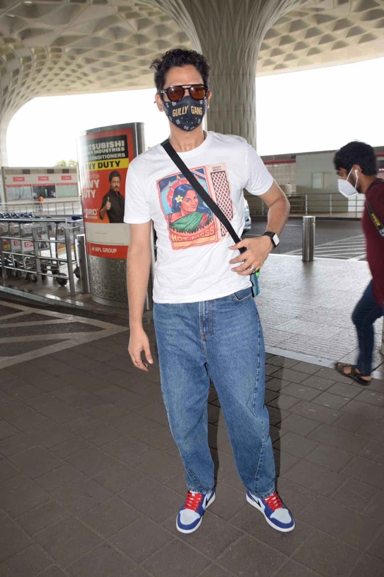 Vijay Varma, OK Computer's actor, posed for the paparazzi when snapped at the airport.