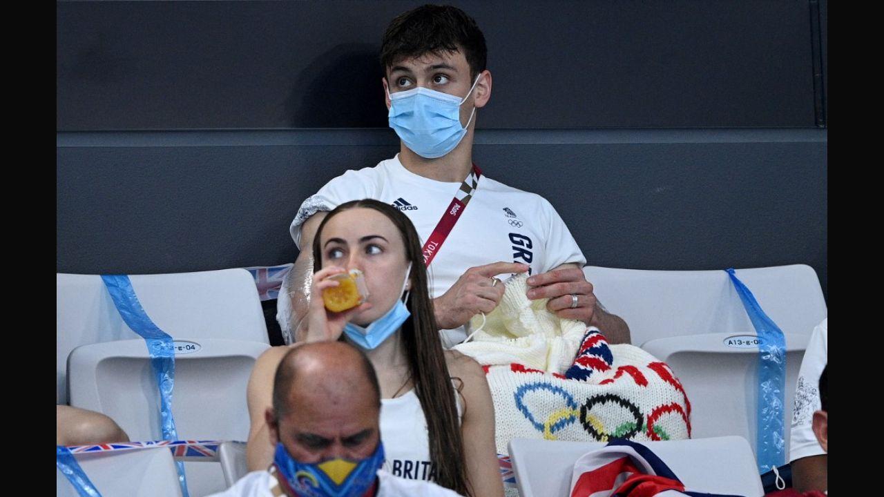 British diver Thomas Daley won the gold medal at the synchronized 10-m platform diving event with his diving partner Matty Lee but what won the hearts of fans around the world was his knitting skills. Daley was spotted knitting an Olympic-themed cardigan during the event while competing or being in the stands watching other events. He not only made a cardigan but also a sleeve for his gold medal to avoid any scratches on it, and even fashioned a sweater for his friend’s French bulldog. In this photo, Daley sits with his knitting as he watches divers in the preliminary round of the men's 3-m springboard diving event during the Tokyo 2020 Olympic Games at the Tokyo Aquatics Centre in Tokyo on August 2, 2021. Photo: AFP 