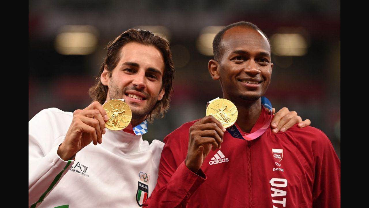 Joint gold medalists Mutaz Essa Barshim and Gianmarco Tamberi pose on the podium of the men's high jump final during the Tokyo 2020 Olympic Games at the Olympic Stadium in Tokyo on August 2, 2021. Photo: AFP