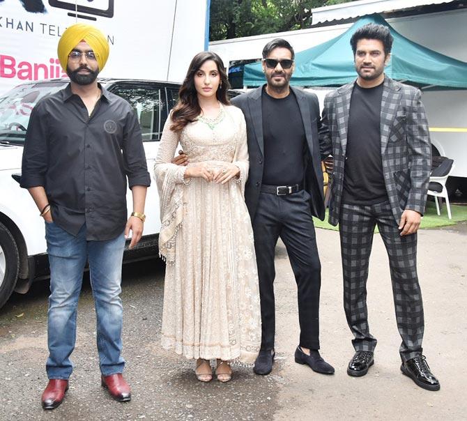 Ajay Devgn, Nora Fatehi, Sharad Kelkar and Ammy Virk were clicked at Filmcity in Goregaon, Mumbai, on the sets of The Kapil Sharma Show. The stars were all geared up to promote their film 'Bhuj: The Pride of India'.