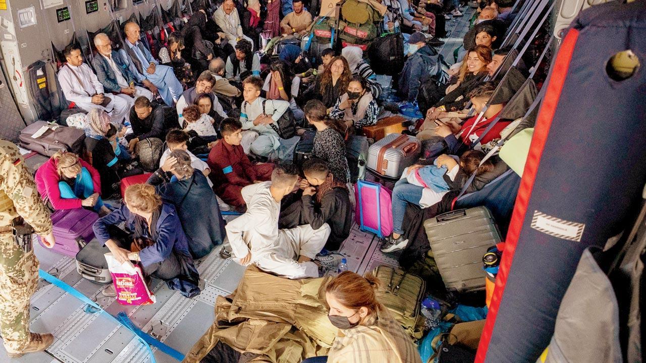 Afghan crisis: Taliban uses gunfire, whips to control crowd at Kabul airport