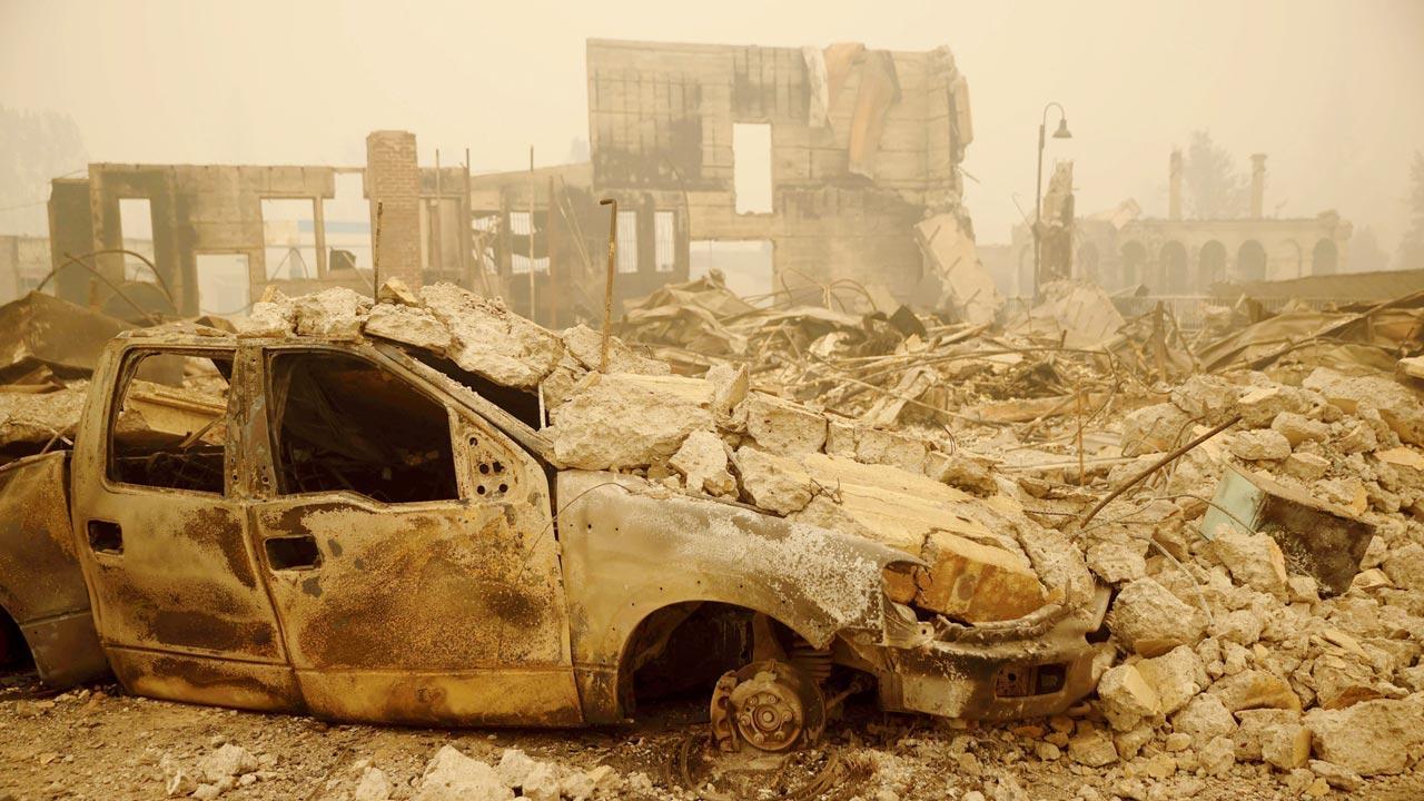 Wildfire bears down on Montana towns as West burns