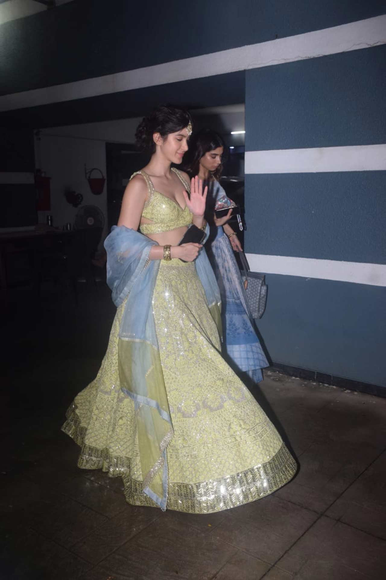 Shanaya and Khushi Kapoor walked into the family function together, and the sister duo looked pretty in bright coloured lehengas.