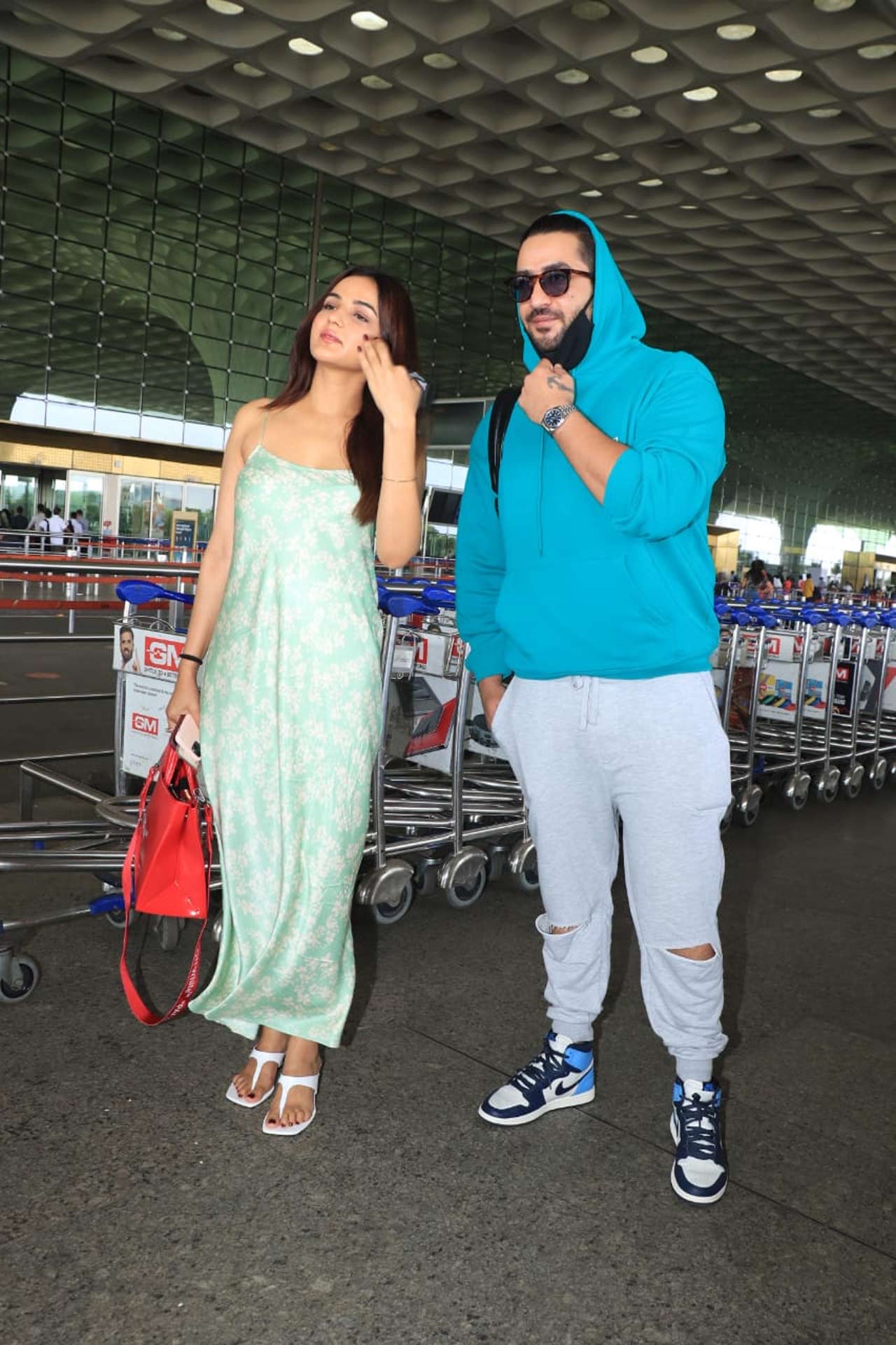 Jasmin Bhasin and Aly Goni, one of the most-talked-about couples in the television industry, posed for the shutterbugs at the Mumbai airport. Jasmin sported a flowy satin maxi dress for the outing, whereas Aly opted for a comfy casual outfit. On the work front, the duo made last on-screen appearance together for a popular single.