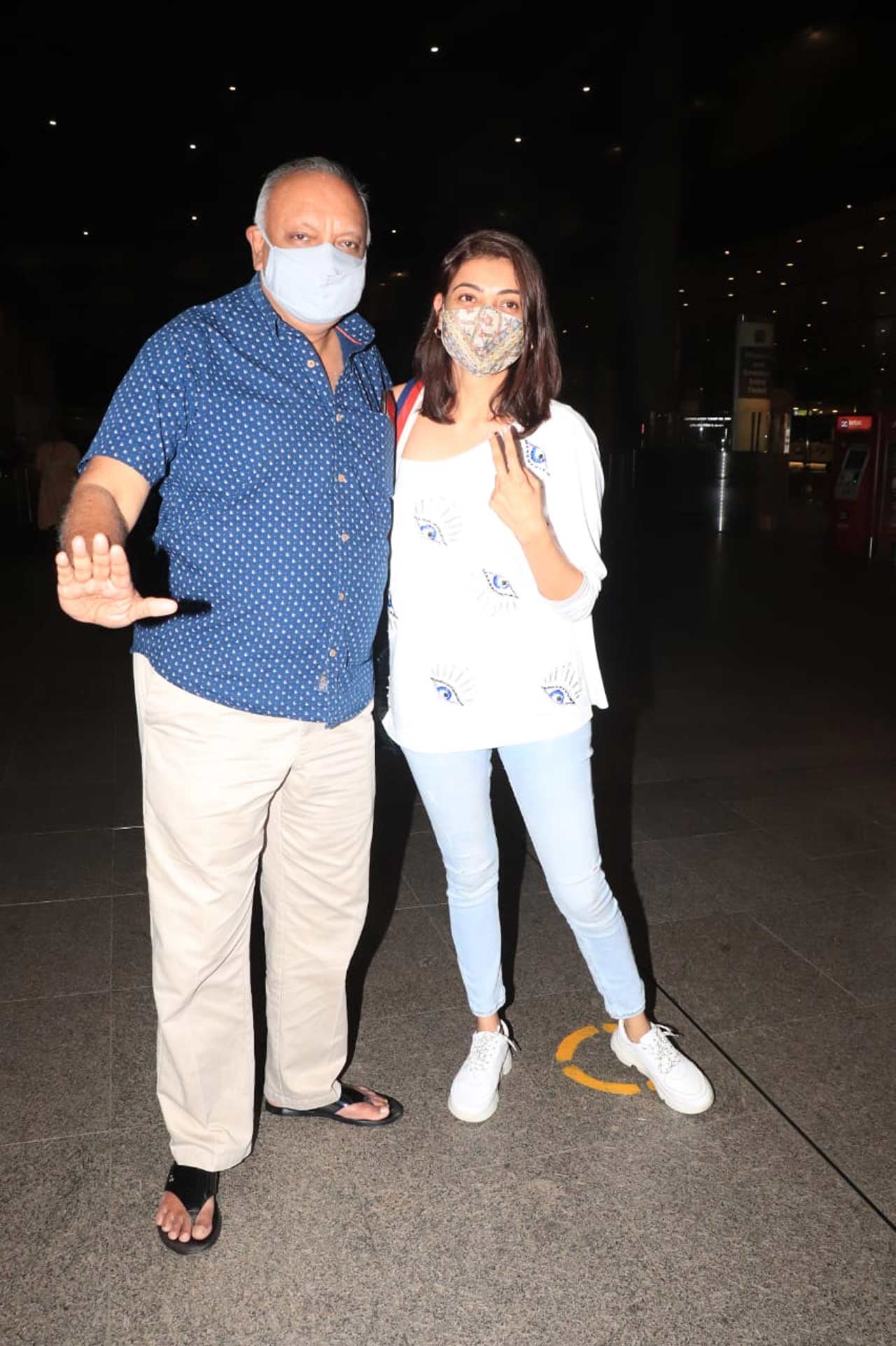 Kajal Aggarwal posed with her dad, who accompanied her at the Mumbai airport. On the work front, the actress has a series of movie releases - Ghosty, Acharya, Indian 2, Paris Paris, among others.