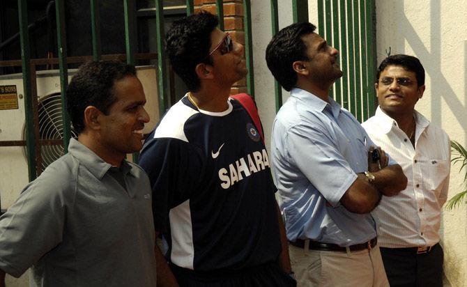 Sunil Joshi, Venkatesh Prasad, Javagal Srinath and Sujeet Soma Sundaram stare at the monument wall at Chinnaswamy stadium in Bangalore in order to mark Dravid's 10,000 Test runs in September 2008. Pic/ Suresh K.K.