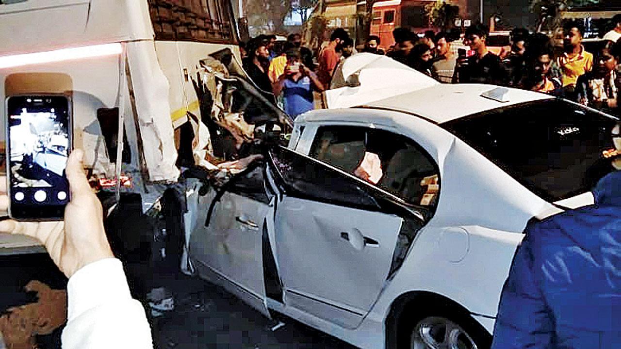 The car hit the parked bus with so much impact that the roof of the car broke