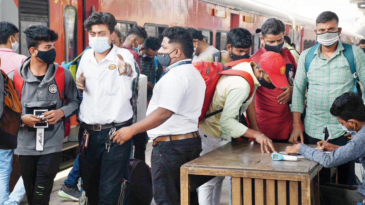 Passengers register for Covid-19 test on arrival aboard long-distance trains, at Dadar station on Tuesday. Pic/Ashish Raje