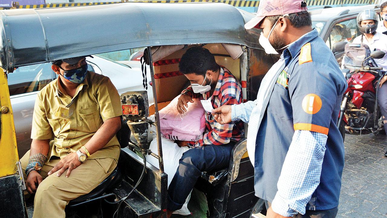 A marshal collects fines at Chembur on Tuesday. Pic/Sayyed Sameer Abedi
