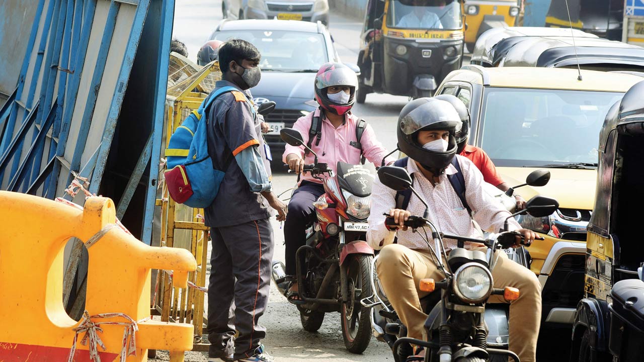 mid-day reporter Shirish Vaktania (above and right) during his training as a BMC marshal at the Santacruz-Kalina junction on Western Express Highway.