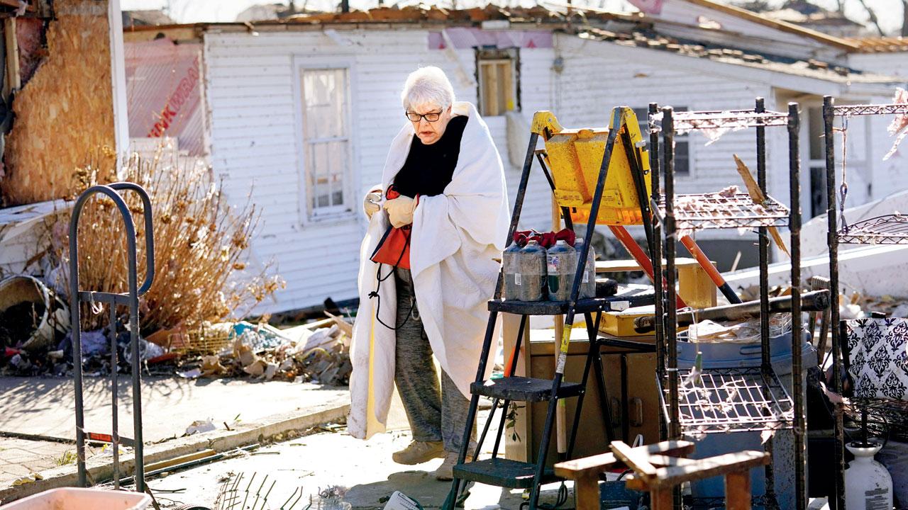 Martha Thomas stands outside her destroyed home in Kentucky. Pic/AP