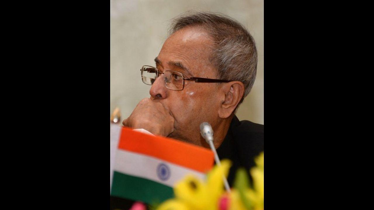 Later, not hiding his emotions on the development, Mukherjee wrote, When I learned of my ouster from the Cabinet, I was shell-shocked and flabbergasted. I could not believe it. But I composed myself and sat alongside my wife as she watched the swearing-in ceremony on television. Pic/AFP
