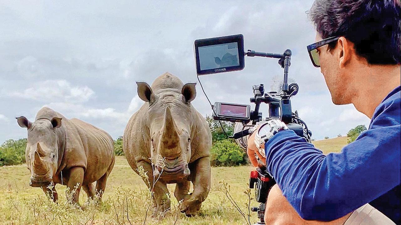 Keshari shoots rhinos. The small on-field team consists of two cameramen, the guide and Keshari, who is host and driver