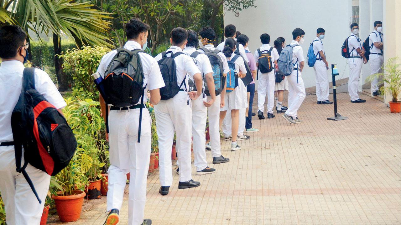 Students wait outside Delhi Public School, Nerul. This year board exams will take place in the offline mode, unlike last year. File pic