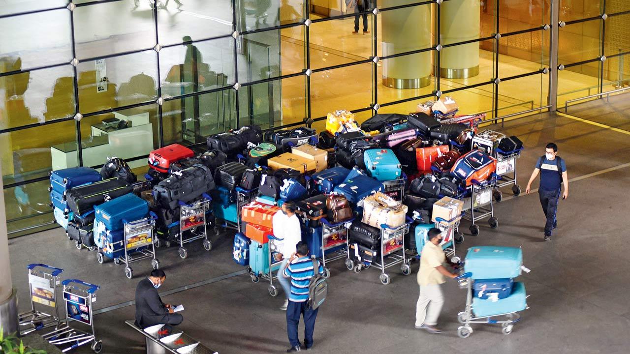 Passengers wait to enter the Mumbai international airport, on November 30. Pic/Sameer Markande