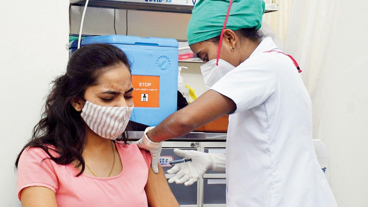 A woman receives a vaccine dose at Nair hospital on Wednesday. Pic/Ashish Raje